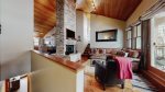 Bi-level 2 Bedroom  loft features a spacious living area and high vaulted ceilings and a wood-burning fireplace